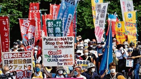 Protesters march against the talks between the US, Japan and other Quad leaders in Tokyo, Japan. REUTERS