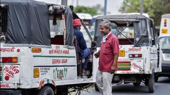 Gramin Sewa autorickshaw drivers wait for passengers at Shastri Park Metro station. (Raj K Raj/HT photo)