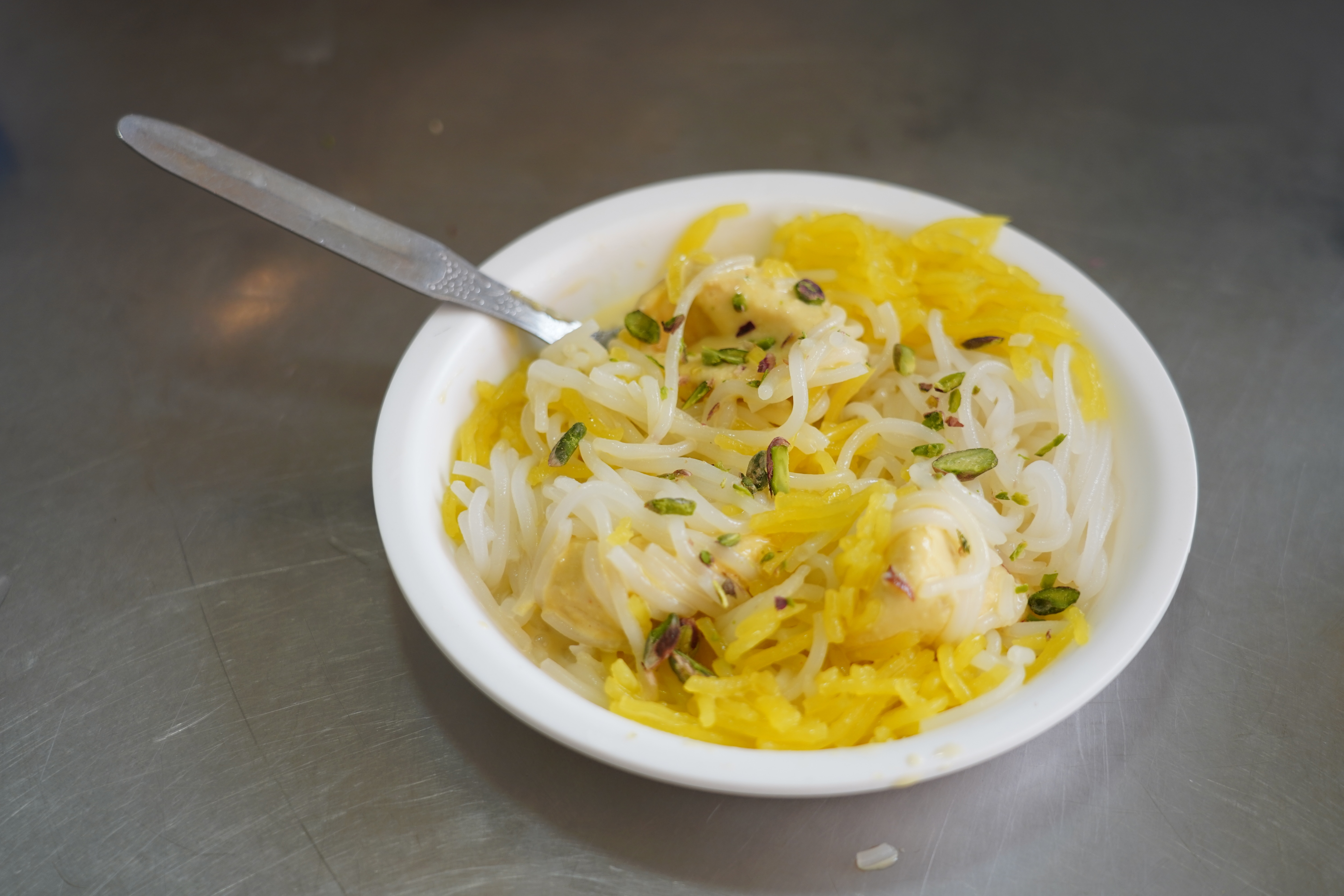 Roshan Di Kulfi’s Kulfi Faluda Kesar Pista Badam is the most sought after here, and can be vouched for its divine taste. (Photo: Gokul VS/HT) Roshan Di Kulfi’s Kulfi Faluda Kesar Pista Badam is the most sought after here, and can be vouched for its divine taste. (Photo: Gokul VS/HT)