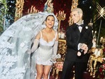 Kourtney Kardashian and Travis Barker at their wedding. Kourtney Kardashian and Travis Barker at their wedding.