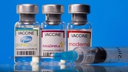 FILE PHOTO: Vials with Pfizer-BioNTech, AstraZeneca, and Moderna coronavirus disease (COVID-19) vaccine labels are seen in this illustration picture.