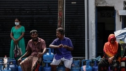 People wait in a line to buy domestic gas tanks near a distributor, amid the country's economic crisis, in Colombo, Sri Lanka, May 23, 2022. REUTERS/Dinuka Liyanawatte