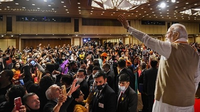 Prime Minister Narendra Modi waves towards members of the Indian community during an event, in Tokyo. (PTI Photo) Prime Minister Narendra Modi waves towards members of the Indian community during an event, in Tokyo. (PTI Photo)