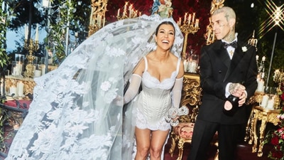 Kourtney Kardashian and Travis Barker at their wedding. Kourtney Kardashian and Travis Barker at their wedding.