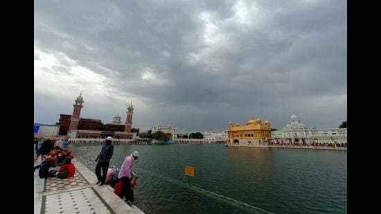 The Golden Temple in Amritsar on a cloudy Monday morning. The temperature dipped by several degrees after overnight rain in Punjab and neighbouring Haryana. (Sameer Sehgal/HT)