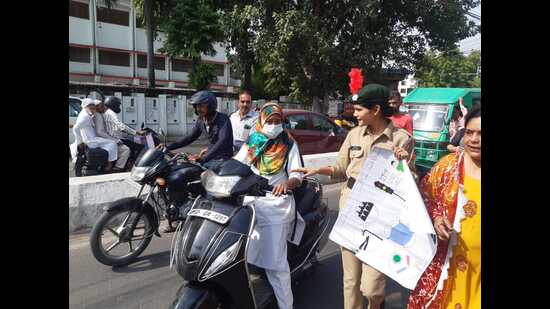 Traffic awareness drive underway in Lucknow on Monday. (HT PHOTO)