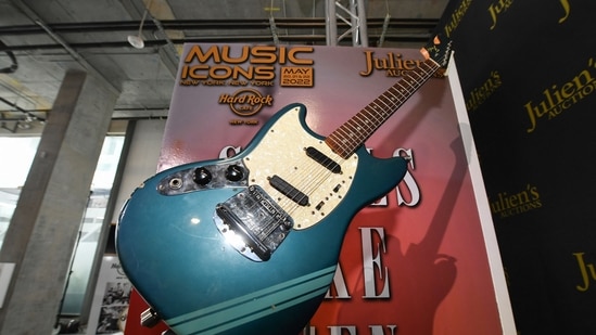 The blue 1969 Mustang Fender guitar used by rock icon Kurt Cobain in the 1991 Nirvana music video "Smells Like Teen Spirit" is displayed at the media preview of the "Music Icons" auction, at Julien's Auctions in Beverly Hills, California, on April 11, 2022.(AFP) The blue 1969 Mustang Fender guitar used by rock icon Kurt Cobain in the 1991 Nirvana music video "Smells Like Teen Spirit" is displayed at the media preview of the "Music Icons" auction, at Julien's Auctions in Beverly Hills, California, on April 11, 2022.(AFP)