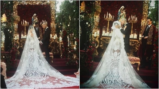 Kourtney Kardashian marries Travis Barker in a one-of-a-kind white mini costume and hand-embroidered veil: See viral pics 5 Travis complemented his wife in a double-breasted jacket with peaked lapels and classic trousers with pressed crease, both in superfine Italian black wool and silk satin. He paired the set with a white shirt, a black silk satin bow-tie, a golden cross brooch with black crystals, and dress shoes.(Instagram/@dolcegabbana)