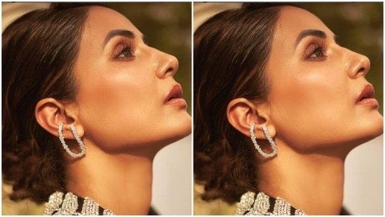 Hina’s blazer’s one collar featured details in silver rhinestones. Hina accessorised her look with silver earrings.(Instagram/@realhinakhan)