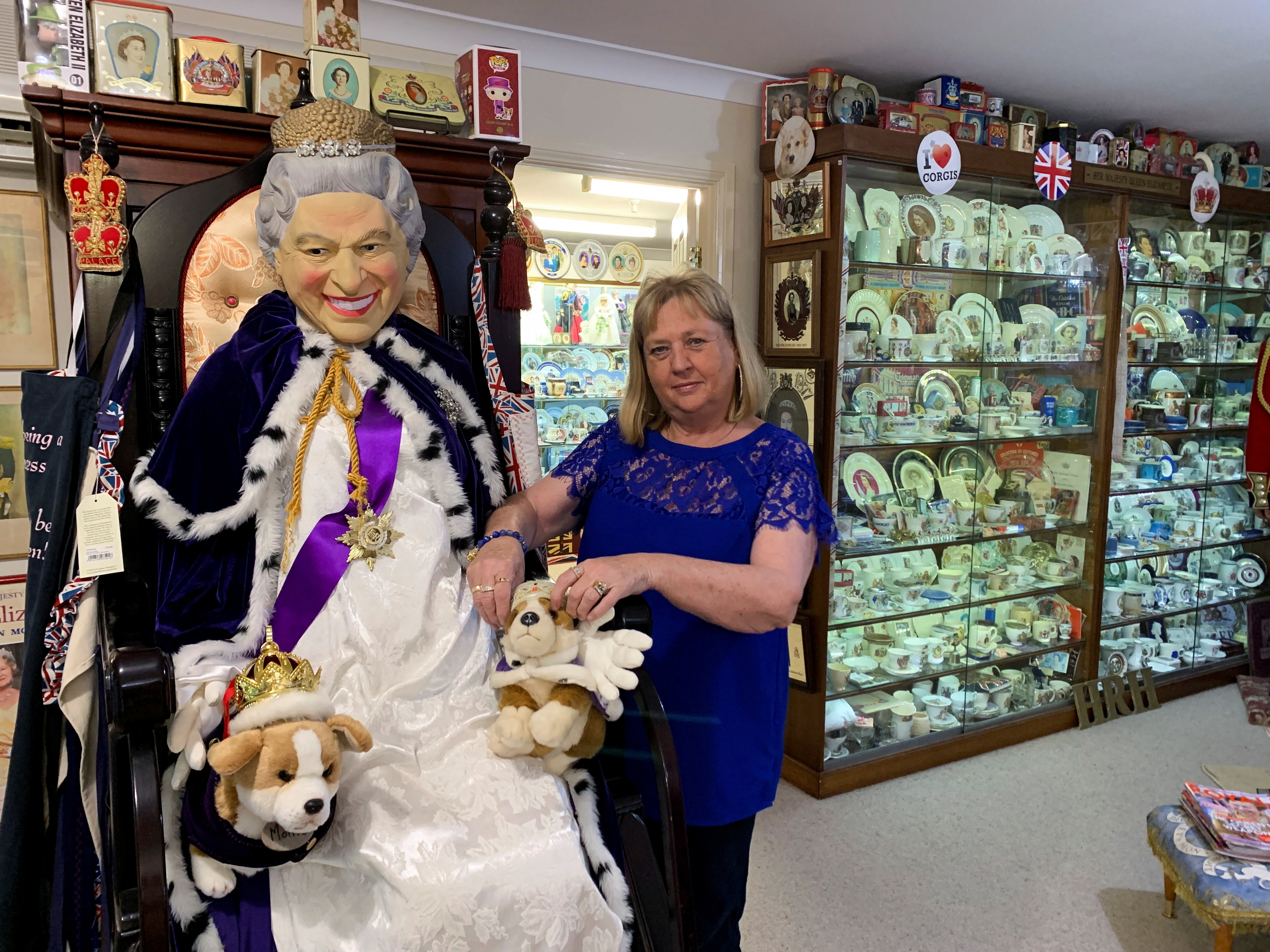 British royal family memorabilia collector Jan Hugo stands near a life size figure of Queen Elizabeth II surrounded by her collection that boosts over 10,000 pieces and is Australia’s largest collection of royal memorabilia, in Nulkaba, Australia May 4, 2022.&nbsp; (REUTERS)