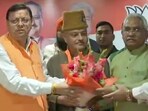 Ajay Kothiyal joins the BJP in the presence of CM Pushkar Singh Dhami in Dehradun on Tuesday. (ANI Twitter)