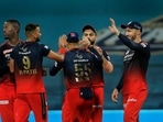 Harshal Patel of Royal Challengers Bangalore celebrates after picking a wicket with teammates(IPL) Harshal Patel of Royal Challengers Bangalore celebrates after picking a wicket with teammates(IPL)