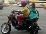 Santosh Kumar Sahu and his wife Munni on their new vehicle.(ANI)