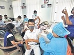 A student receives a dose of Covid-19 vaccine in Jammu. A student receives a dose of Covid-19 vaccine in Jammu.