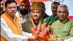 Uttarakhand chief minister Pushkar Singh Dhami and state BJP president Madan Kaushik welcome former AAP leader Col Ajay Kothiyal (retd) to the BJP in Dehradun (PTI)