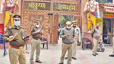 Mathura: Police personnel guard outside the Sri Krishna Janambhoomi temple in Mathura, Sunday, Dec 5, 2021. Security has been tightened in Mathura after Akhil Bharat Hindu Mahasabha announced its plan to perform ‘jalabhishek’ at Shahi Eidgah in Mathura and install Shri Krishna idol on December 6. (PTI Photo) (PTI12_05_2021_000063A) (PTI) Mathura: Police personnel guard outside the Sri Krishna Janambhoomi temple in Mathura, Sunday, Dec 5, 2021. Security has been tightened in Mathura after Akhil Bharat Hindu Mahasabha announced its plan to perform ‘jalabhishek’ at Shahi Eidgah in Mathura and install Shri Krishna idol on December 6. (PTI Photo) (PTI12_05_2021_000063A) (PTI)