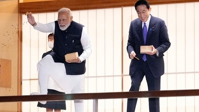 Prime Minister Narendra Modi and his Japanese counterpart Fumio Kishida feed carp before their dinner at Akasaka Palace state guest house in Tokyo on Tuesday,&nbsp; (AP)