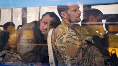 Ukrainian servicemen sit in a bus after they were evacuated from the besieged Mariupol's Azovstal steel plant. (AP file) Ukrainian servicemen sit in a bus after they were evacuated from the besieged Mariupol's Azovstal steel plant. (AP file)