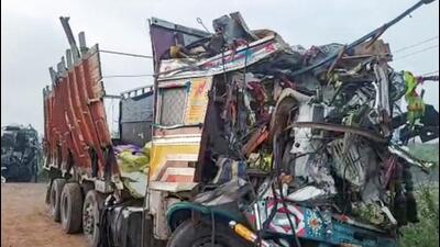 Mangled remains of vehicles after a collision between a lorry and a private bus, in Hubballi on Tuesday morning. (PTI PHOTO.)