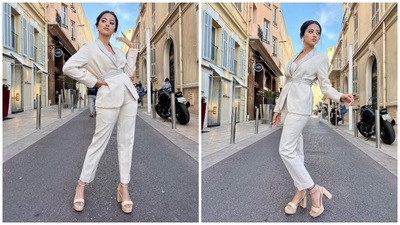 The second look shows Helly in an ivory classic blazer suit set featuring intricate embellishments. The jacket has a figure-skimming silhouette, notch lapel collars adorned with pearls, long sleeves and a fabric belt decked with pearls and secured at the waist. Matching pants, heels and minimal accessories rounded it all off. (Instagram)
