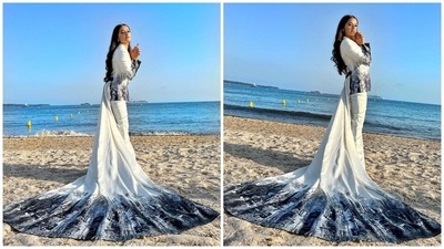 Coming to Helly Shah, the television actor dropped these pictures on Instagram today. She donned a white printed pantsuit from the shelves of designers Shantanu and Nikhil's label and posed on a beach in Cannes. The getup features straight-fitted pants and a blazer adorned with a long train attached to the back. (Instagram) Coming to Helly Shah, the television actor dropped these pictures on Instagram today. She donned a white printed pantsuit from the shelves of designers Shantanu and Nikhil's label and posed on a beach in Cannes. The getup features straight-fitted pants and a blazer adorned with a long train attached to the back. (Instagram)