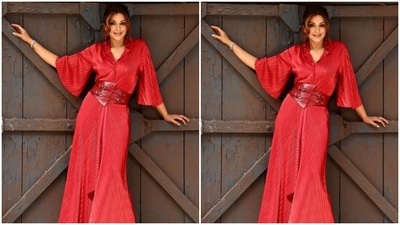 Sonali’s red gown featured collars and loose half sleeves. The gown came with leathered belt details at the waist. The gown, throughout, featured pleated details. (Instagram/@iamsonalibendre)