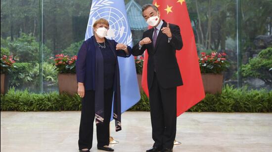 Chinese foreign minister Wang Yi (right) meets with the United Nations High Commissioner for Human Rights Michelle Bachelet in Guangzhou, southern China’s Guangdong Province on Monday. (AP)