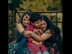 The bride with her sister and nephew with autism, in her wedding photoshoot. (Instagram/@houseofthapas)
