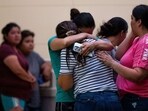 People mourn outside of the SSGT Willie de Leon Civic Center following the mass shooting at Robb Elementary School in Uvalde, Texas.(AFP)