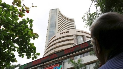 A man looks at a screen across a road displaying the Sensex on the facade of the Bombay Stock Exchange (BSE) building in Mumbai, India. (File image) (REUTERS)