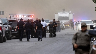 Law enforcement work the scene after a mass shooting at Robb Elementary School where 18 children were killed in Uvalde, Texas. (AFP) Law enforcement work the scene after a mass shooting at Robb Elementary School where 18 children were killed in Uvalde, Texas. (AFP)