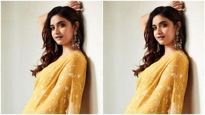 Keerthy merged ethnic fashion and comfort into a pastel yellow ruffle saree as she posed for the pictures. (Instagram/@keerthysureshofficial)