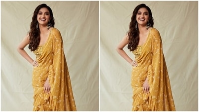 The saree came intricately detailed in miniature floral patterns in white. Keerthy paired it with a sleeveless corset ochre blouse detailed in white resham threads and mirror work. (Instagram/@keerthysureshofficial)