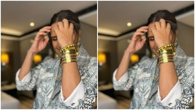 Styled by fashion stylist Ayesha Khanna, Neha wore her tresses into a messy bun with a middle part. (Instagram/@nehadhupia)
