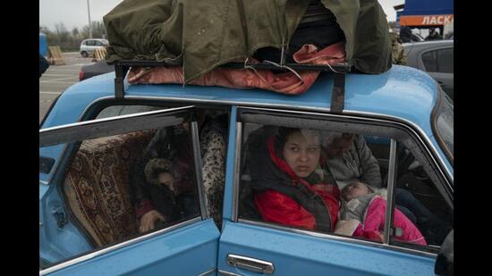 Internally displaced people from Mariupol and nearby towns arrive at a refugee center fleeing Russian attacks in Zaporizhzhia, Ukraine, Thursday, April 21, 2022. Mariupol, which is part of the industrial region in eastern Ukraine known as the Donbas, has been a key Russian objective since the invasion began. (Leo Correa/AP)