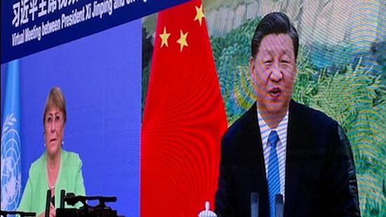 UN human rights chief Michelle Bachelet (left) attending a virtual meeting with China’s President Xi Jinping, in Guangzhou. (AFP)