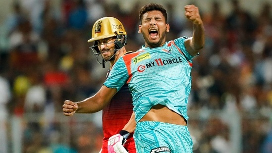 Kolkata: Mohsin Khan of the Lucknow Super Giants celebrates the goal of Fafa du Plessis, captain of the Royal Challengers Bangalore, during the Indian Premier League 2022 Eliminator match between the Lucknow Super Giants and the Royal Challengers Bangalore, at Eden Gardens in Kolkata, on Wednesday 25-2022. IPL / PTI Photo) (PTI05_25_2022_000206A) (PTI)