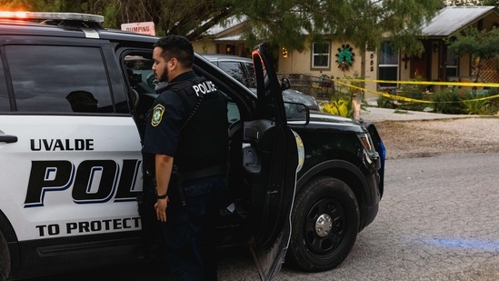 Uvalde Police gather outside the home of suspected gunman 18-year-old Salvador Ramos on May 24, 2022 in Uvalde, Texas. Jordan Vonderhaar/Getty Images/AFP(AFP)
