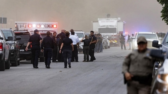 Law enforcement work the scene after a mass shooting at Robb Elementary School where over 18 children were killed in Uvalde, Texas.(AFP)