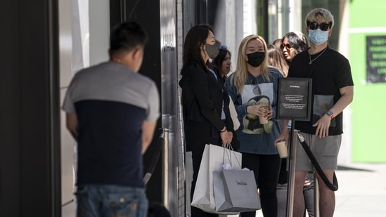 Shoppers wait in line to enter a Chanel store in San Francisco, California, US. US retail sales grew at a solid pace in April, reflecting broad-based gains and suggesting demand for merchandise remains resilient despite rampant inflation.&nbsp;(Photographer: David Paul Morris/Bloomberg)