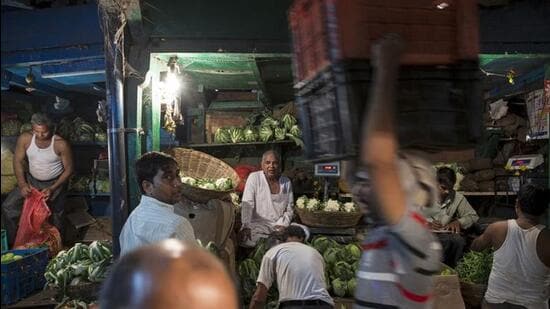 Vendors work at a wholesale vegetable and fruit market in Mumbai Reuters File Photo