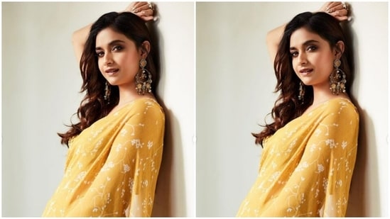 Keerthy merged ethnic fashion and comfort into a pastel yellow ruffle saree as she posed for the pictures.(Instagram/@keerthysureshofficial)