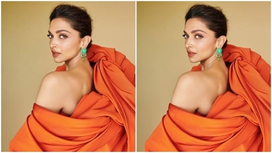 Deepika picked an orange gown for the red carpet. She decked up in it and posed for both outdoor and indoor photoshoot.(Instagram/@deepikapadukone)