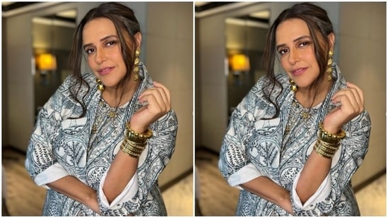 Assisted by makeup artist Mita Vaswani, Neha decked up in nude eyeshadow, mascara-laden eyelashes, contoured cheeks and a shade of soft pink lipstick.(Instagram/@nehadhupia)