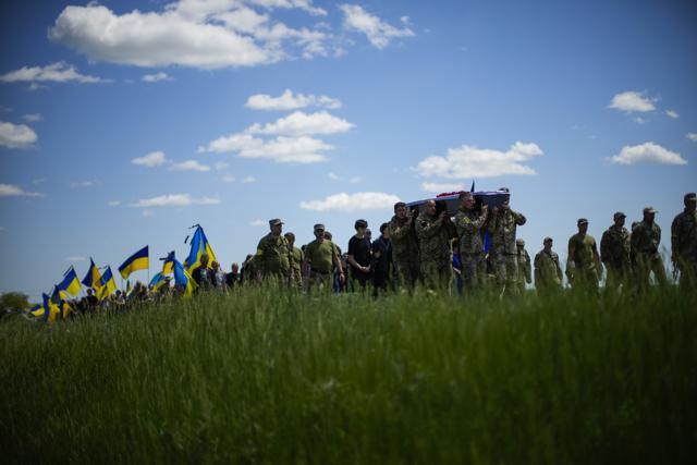 Ukrainian soldiers carry the coffin of Volodymyr Losev, 38, during his funeral in Zorya Truda, Odesa region, Ukraine, Monday, May 16, 2022. Volodymyr Losev, a Ukrainian volunteer soldier, was killed on May 7 when the military vehicle he was driving ran over a mine in eastern Ukraine. (Francisco Seco/AP) Ukrainian soldiers carry the coffin of Volodymyr Losev, 38, during his funeral in Zorya Truda, Odesa region, Ukraine, Monday, May 16, 2022. Volodymyr Losev, a Ukrainian volunteer soldier, was killed on May 7 when the military vehicle he was driving ran over a mine in eastern Ukraine. (Francisco Seco/AP)