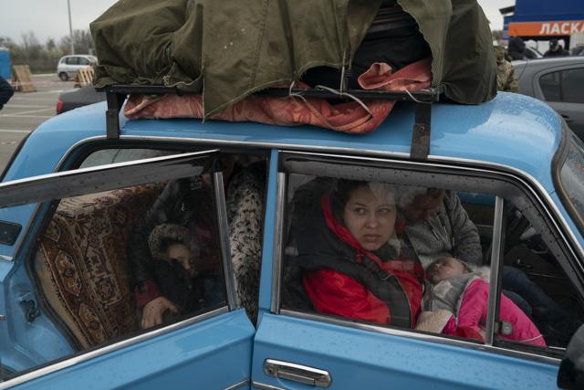 Internally displaced people from Mariupol and nearby towns arrive at a refugee center fleeing Russian attacks in Zaporizhzhia, Ukraine, Thursday, April 21, 2022. Mariupol, which is part of the industrial region in eastern Ukraine known as the Donbas, has been a key Russian objective since the invasion began. (Leo Correa/AP) Internally displaced people from Mariupol and nearby towns arrive at a refugee center fleeing Russian attacks in Zaporizhzhia, Ukraine, Thursday, April 21, 2022. Mariupol, which is part of the industrial region in eastern Ukraine known as the Donbas, has been a key Russian objective since the invasion began. (Leo Correa/AP)