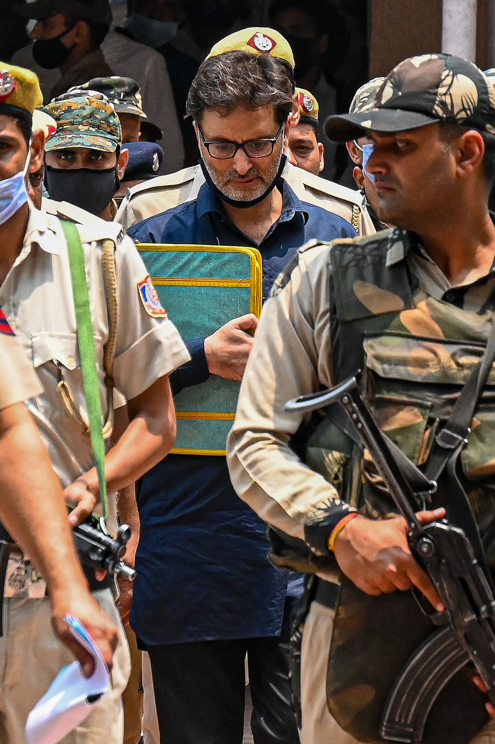File photo of Yasin Malik being escorted to the Patiala House Court in New Delhi.(AFP) File photo of Yasin Malik being escorted to the Patiala House Court in New Delhi.(AFP)