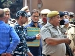 Yasin Malik, chairman of Jammu Kashmir Liberation Front (JKLF), a separatist party, is escorted by police officers at court premises.