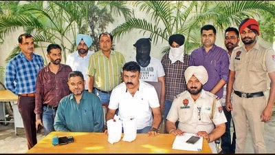 The accused in custody of Ludhiana police. One of them is a realtor and the other, a farmer. (HT Photo)