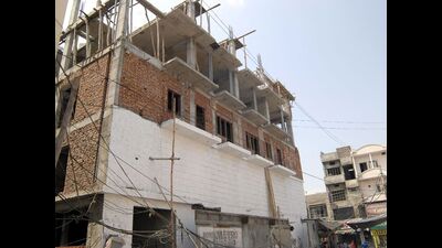 The building inspector has been accused of helping the owner of a colony evade external development charges and build two additional floors. (Representative image/HT)